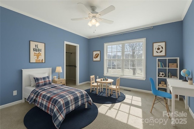 1285 Waitman Rd, Lexington, NC 27295 - carpeted bedroom with ornamental molding, baseboards, a spacious closet, ceiling fan, and a closet