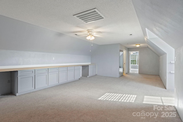 1285 Waitman Rd, Lexington, NC 27295 - additional living space featuring a ceiling fan, light colored carpet, lofted ceiling, and a textured ceiling