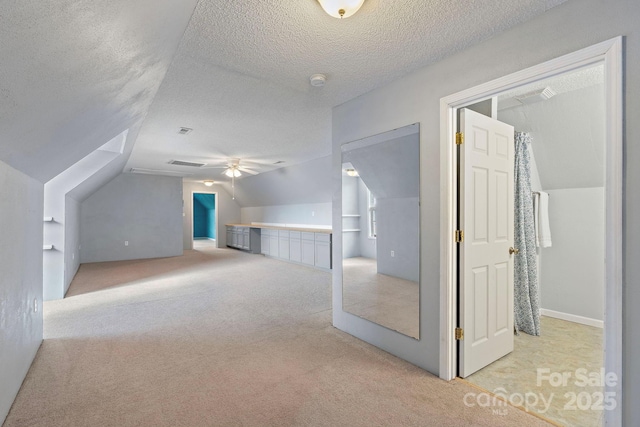 1285 Waitman Rd, Lexington, NC 27295 - additional living space featuring carpet, a textured ceiling, vaulted ceiling, and ceiling fan
