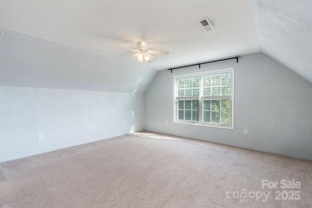 1285 Waitman Rd, Lexington, NC 27295 - bonus room with lofted ceiling, a ceiling fan, carpet flooring, and a textured ceiling