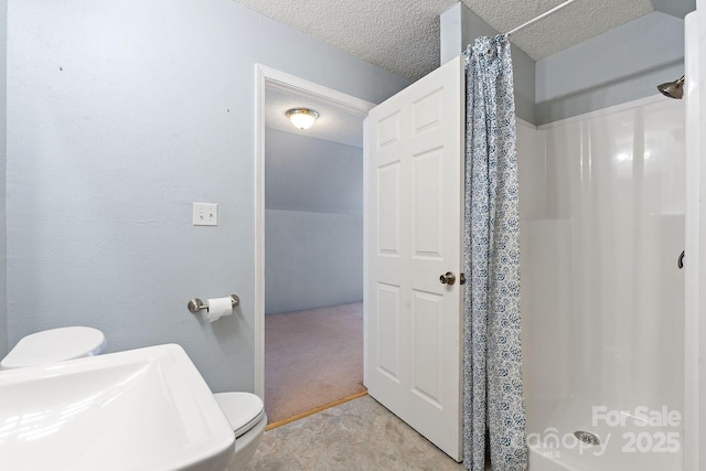 1285 Waitman Rd, Lexington, NC 27295 - full bath with a stall shower, toilet, a textured ceiling, and a sink