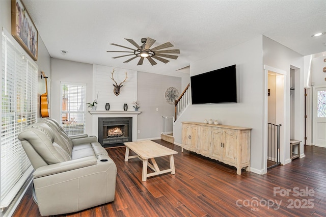 108 Shade Tree Cir, Fort Mill, SC 29715 - living area with dark wood-style floors, a ceiling fan, a large fireplace, and stairway
