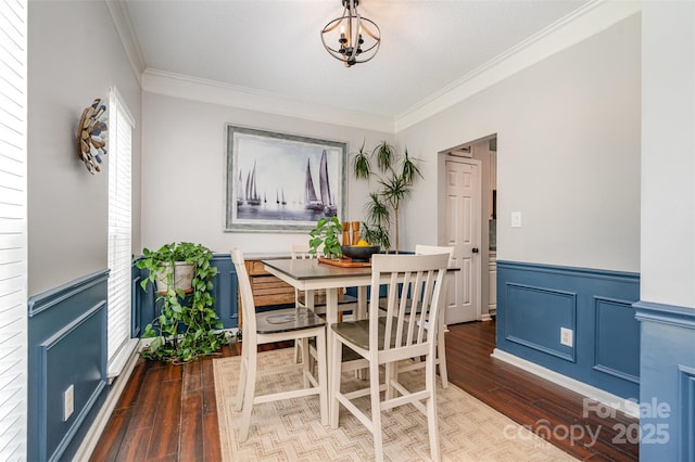 108 Shade Tree Cir, Fort Mill, SC 29715 - dining space with wood finished floors, crown molding, a wainscoted wall, and a chandelier