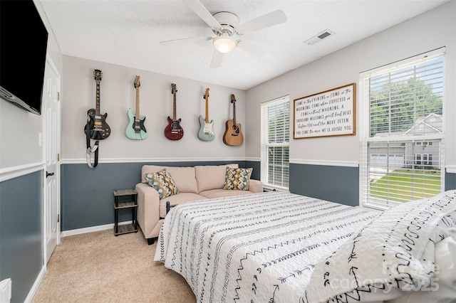 108 Shade Tree Cir, Fort Mill, SC 29715 - carpeted bedroom featuring multiple windows, ceiling fan, and a textured ceiling