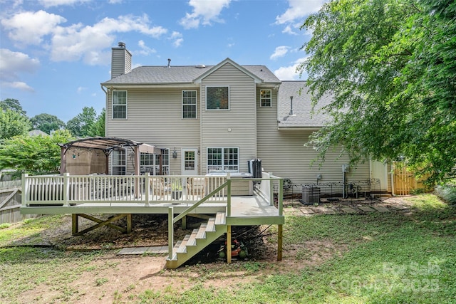 108 Shade Tree Cir, Fort Mill, SC 29715 - rear view of property featuring a deck, a chimney, roof with shingles, and stairs