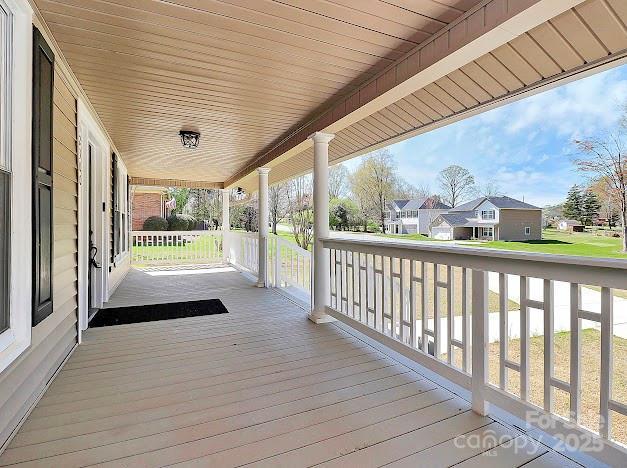 12300 Caldwell Rd, Charlotte, NC 28213 - wooden porch with a residential view