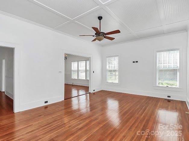 12300 Caldwell Rd, Charlotte, NC 28213 - spare room featuring a ceiling fan, coffered ceiling, and wood finished floors