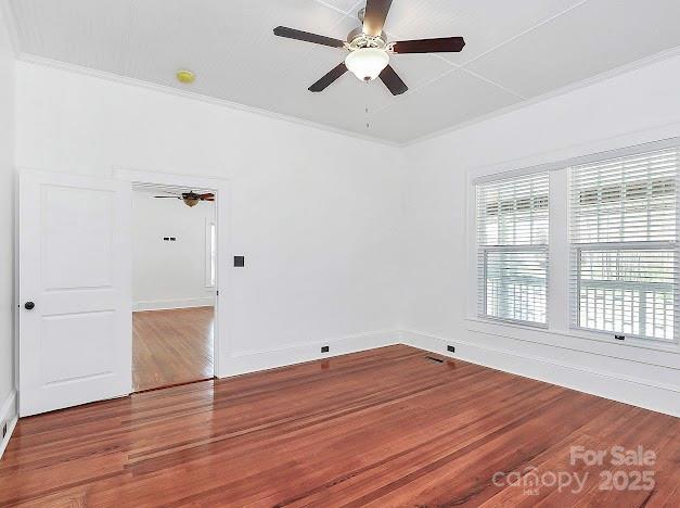 12300 Caldwell Rd, Charlotte, NC 28213 - unfurnished room featuring a ceiling fan, wood finished floors, and crown molding