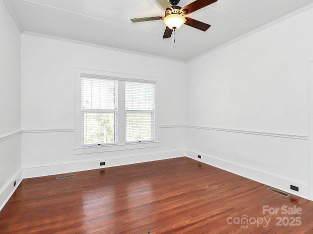 12300 Caldwell Rd, Charlotte, NC 28213 - unfurnished room with wood finished floors, ornamental molding, and a ceiling fan