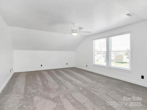 12300 Caldwell Rd, Charlotte, NC 28213 - bonus room with lofted ceiling, ceiling fan, and carpet