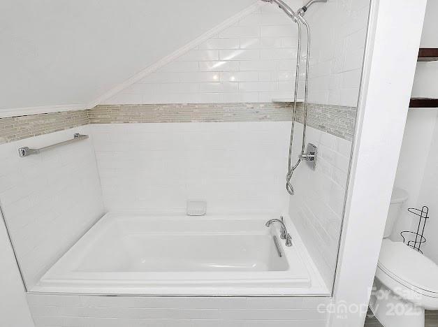 12300 Caldwell Rd, Charlotte, NC 28213 - bathroom with toilet and shower / washtub combination