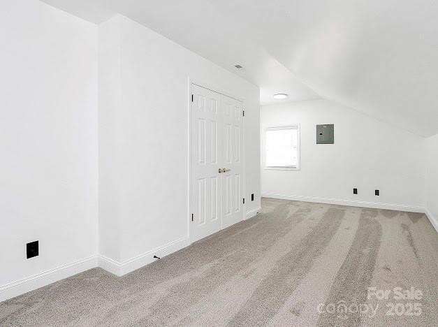 12300 Caldwell Rd, Charlotte, NC 28213 - bonus room featuring electric panel, carpet, and lofted ceiling