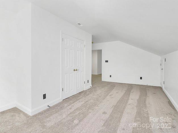 12300 Caldwell Rd, Charlotte, NC 28213 - additional living space with lofted ceiling and carpet