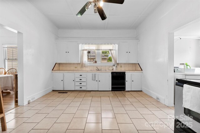 1008 Valley St, Kannapolis, NC 28081 - kitchen with black dishwasher, decorative backsplash, ceiling fan, white cabinets, and a sink