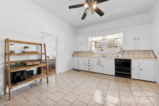 1008 Valley St, Kannapolis, NC 28081 - kitchen with black dishwasher, tile counters, decorative backsplash, ceiling fan, and white cabinetry