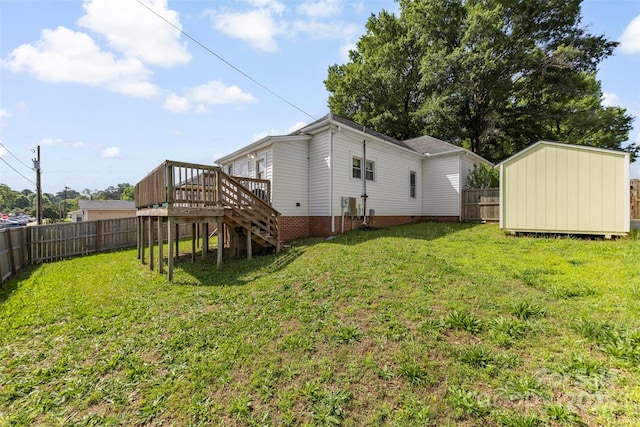 1008 Valley St, Kannapolis, NC 28081 - rear view of property featuring a wooden deck, a fenced backyard, stairs, and a storage shed