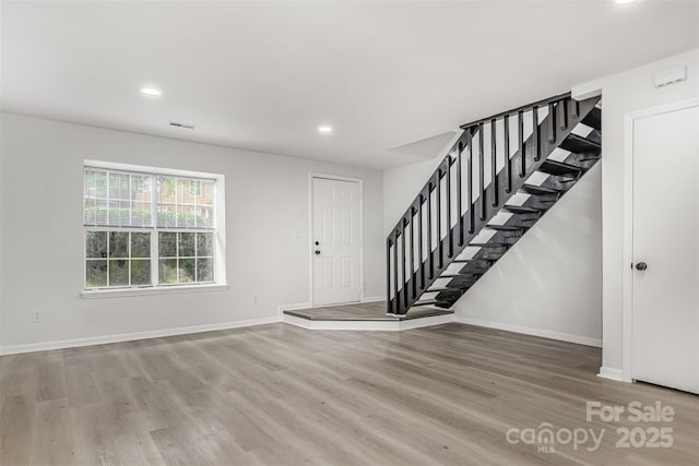 3941 Briarhill Dr, Charlotte, NC 28215 - foyer with stairs, wood finished floors, recessed lighting, and baseboards