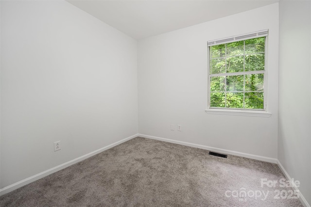 3941 Briarhill Dr, Charlotte, NC 28215 - carpeted empty room with baseboards