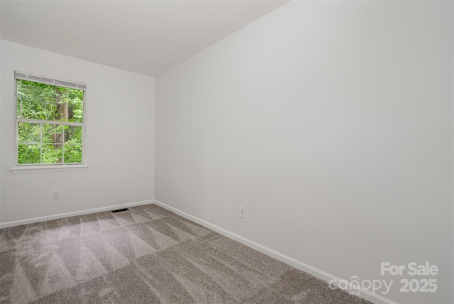 3941 Briarhill Dr, Charlotte, NC 28215 - carpeted spare room with baseboards
