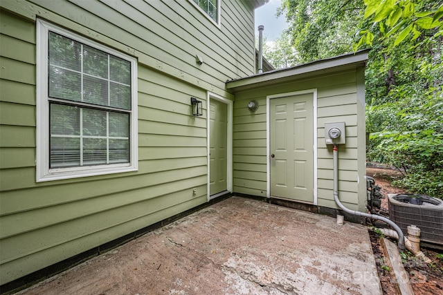 3941 Briarhill Dr, Charlotte, NC 28215 - doorway to property with central AC unit and a patio area
