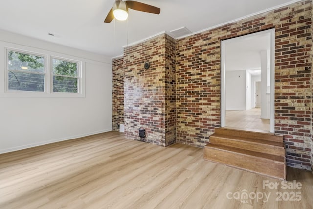 848 Ike Lynch Rd, Dallas, NC 28034 - spare room with wood finished floors, brick wall, and a ceiling fan