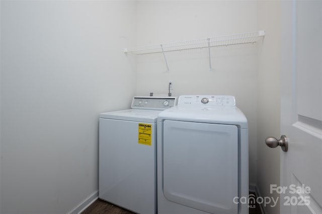 10410 Bradstreet Commons Way, Charlotte, NC 28215 - laundry area featuring washing machine and clothes dryer and dark wood finished floors