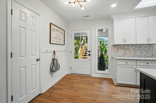 10043 Tepa Pl, Tega Cay, SC 29708 - entrance foyer featuring a chandelier, light wood-type flooring, baseboards, and recessed lighting