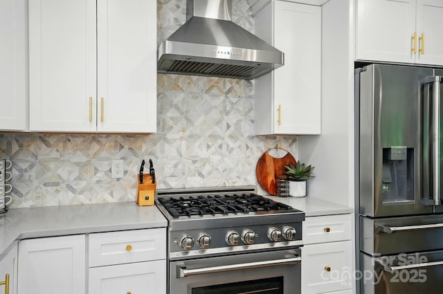 10043 Tepa Pl, Tega Cay, SC 29708 - kitchen featuring stainless steel appliances, wall chimney range hood, and white cabinets
