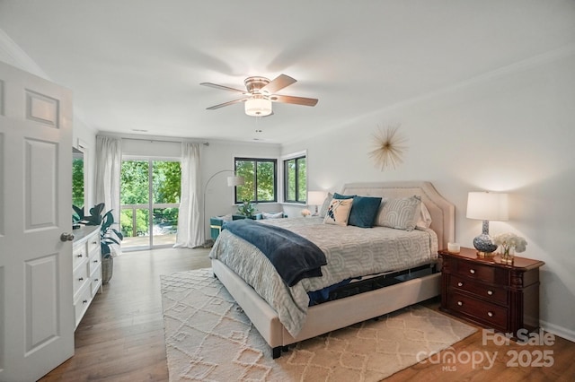 10043 Tepa Pl, Tega Cay, SC 29708 - bedroom featuring access to exterior, wood finished floors, a ceiling fan, and baseboards