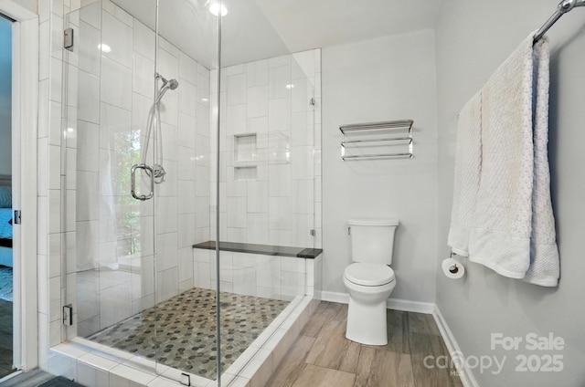 10043 Tepa Pl, Tega Cay, SC 29708 - full bathroom with toilet, a stall shower, wood finished floors, and baseboards