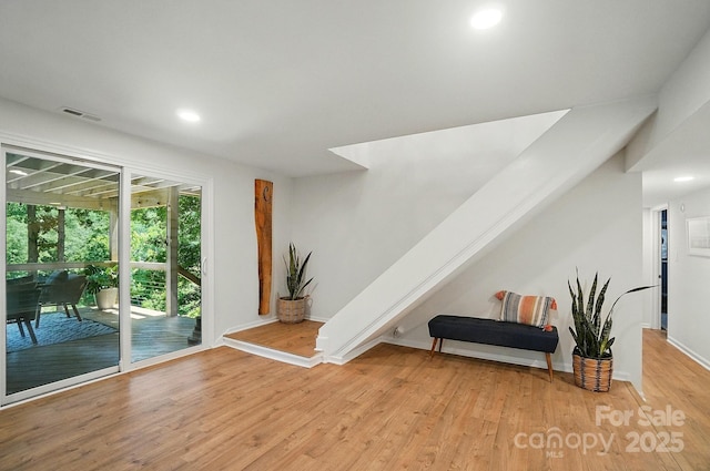 10043 Tepa Pl, Tega Cay, SC 29708 - living area with light wood finished floors, recessed lighting, baseboards, and stairway