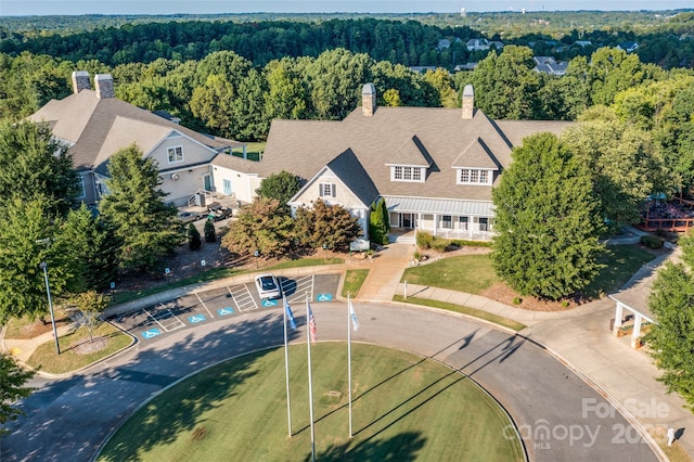 10043 Tepa Pl, Tega Cay, SC 29708 - aerial view of property and surrounding area featuring a heavily wooded area