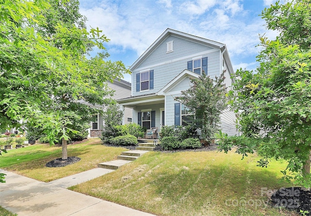 11733 Mesquite Rd, Huntersville, NC 28078 - view of front of home with covered porch and a front lawn