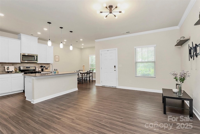 11733 Mesquite Rd, Huntersville, NC 28078 - kitchen featuring appliances with stainless steel finishes, recessed lighting, ornamental molding, dark wood finished floors, and decorative backsplash