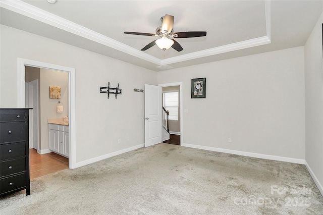 11733 Mesquite Rd, Huntersville, NC 28078 - unfurnished bedroom with light colored carpet, a tray ceiling, ornamental molding, baseboards, and ensuite bathroom