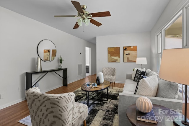 146 Duff St, Gastonia, NC 29715 - living room featuring wood finished floors, ceiling fan, and baseboards