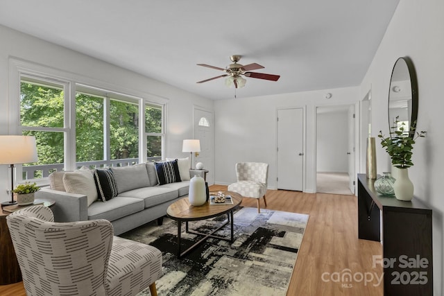 146 Duff St, Gastonia, NC 29715 - living area with ceiling fan, light wood-style flooring, and baseboards