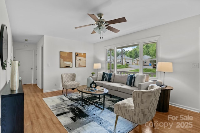 146 Duff St, Gastonia, NC 29715 - living area featuring ceiling fan, light wood-style floors, and baseboards