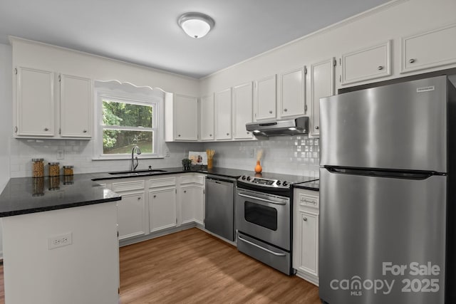 146 Duff St, Gastonia, NC 29715 - kitchen featuring stainless steel appliances, under cabinet range hood, a peninsula, a sink, and white cabinets