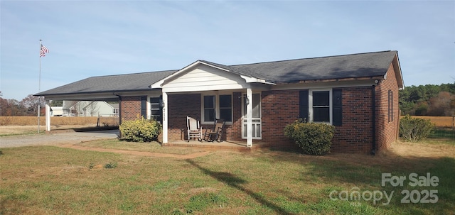 711 Burtonwood Ln, Lincolnton, NC 28092 - view of front of property with a porch, brick siding, and a front lawn