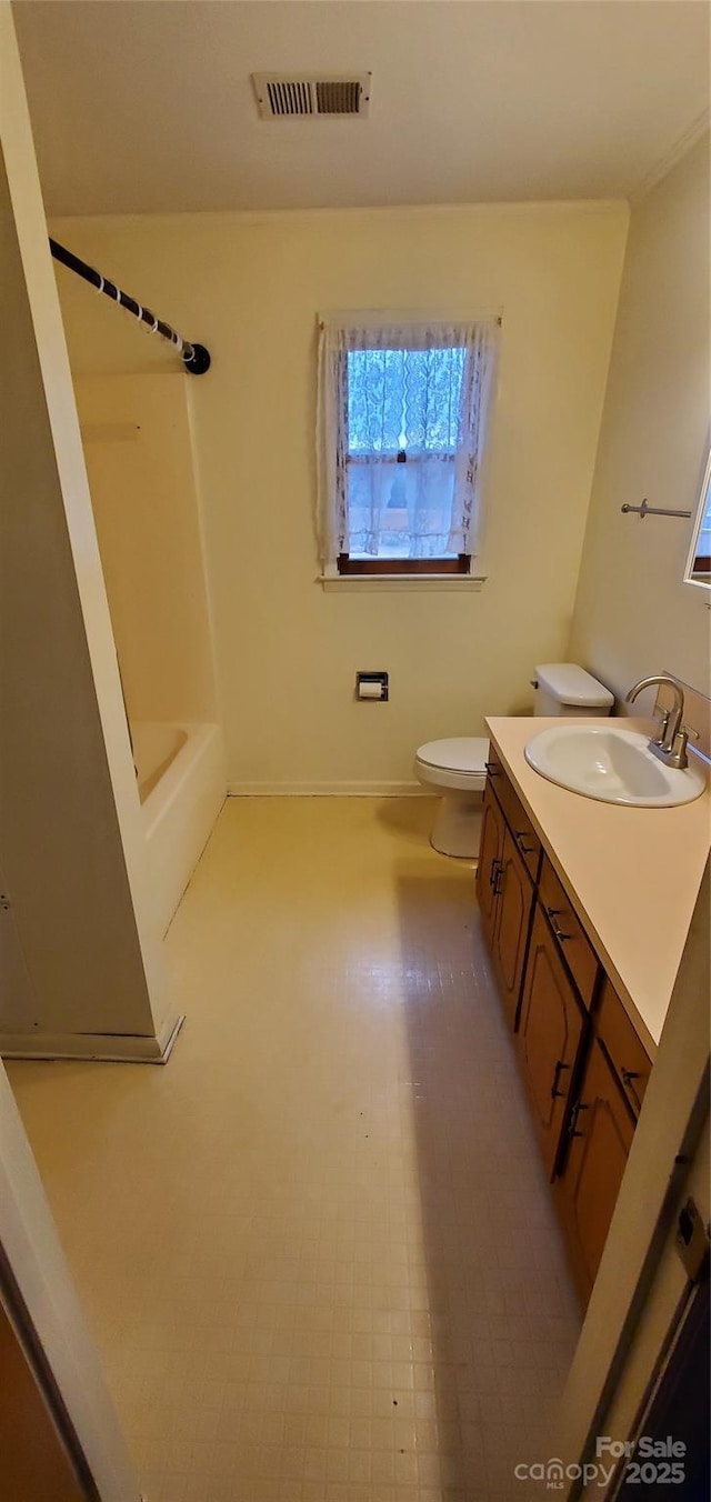 711 Burtonwood Ln, Lincolnton, NC 28092 - bathroom with vanity, toilet, baseboards, and  shower combination