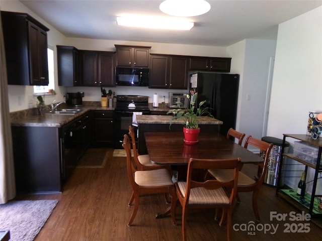 1818 Windy Willow Ln, Dallas, NC 28034 - kitchen featuring black appliances, dark wood-style floors, dark brown cabinetry, and dark countertops