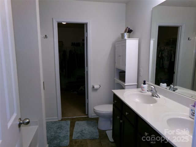 1818 Windy Willow Ln, Dallas, NC 28034 - bathroom featuring double vanity, a walk in closet, and tile patterned flooring