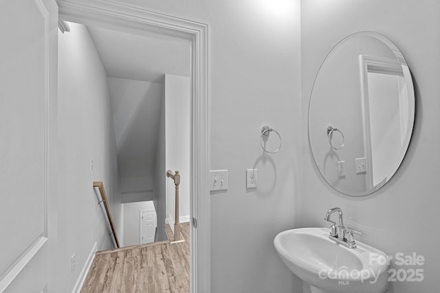 4008 Yucca Aly, Charlotte, NC 28217 - bathroom featuring a sink, wood finished floors, and baseboards