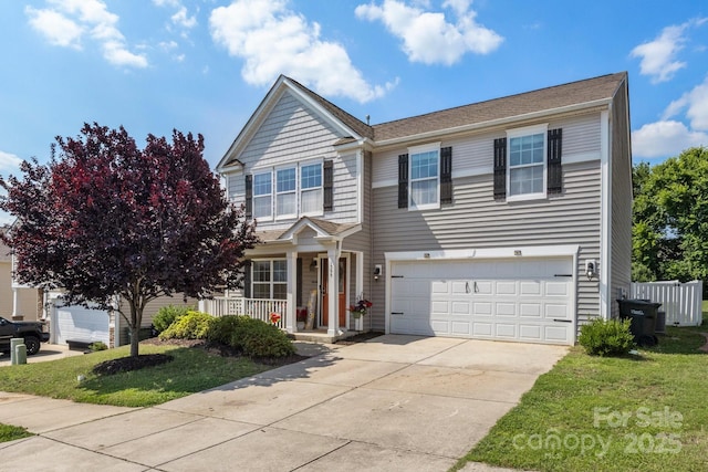 1398 Kent Downs Ave SW Unit 52, Concord, NC 28027 - traditional-style house with a porch, an attached garage, concrete driveway, and a front yard