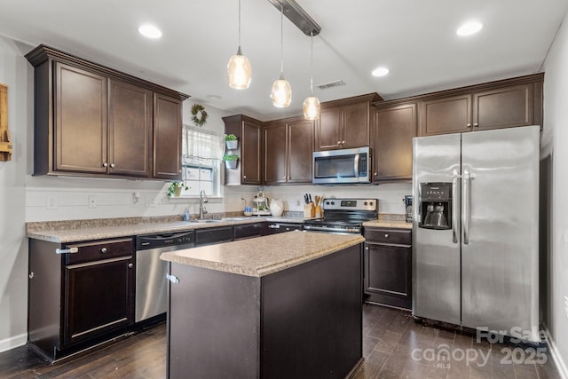 1398 Kent Downs Ave SW Unit 52, Concord, NC 28027 - kitchen featuring stainless steel appliances, dark brown cabinetry, decorative light fixtures, dark wood-type flooring, and recessed lighting