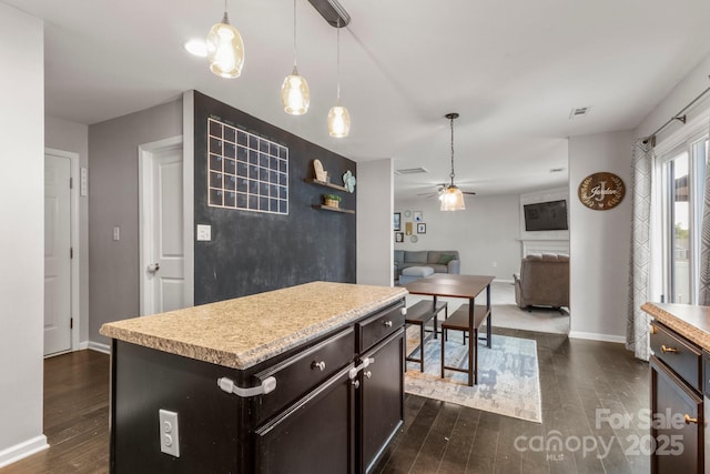 1398 Kent Downs Ave SW Unit 52, Concord, NC 28027 - kitchen featuring ceiling fan, dark wood-type flooring, light countertops, and pendant lighting