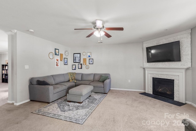 1398 Kent Downs Ave SW Unit 52, Concord, NC 28027 - living area with carpet floors, ceiling fan, a stone fireplace, and baseboards