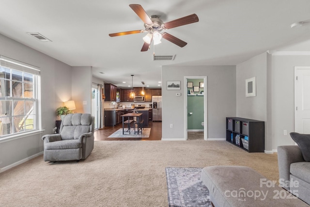 1398 Kent Downs Ave SW Unit 52, Concord, NC 28027 - carpeted living room with ceiling fan and baseboards