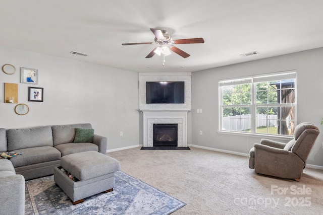 1398 Kent Downs Ave SW Unit 52, Concord, NC 28027 - living room with ceiling fan, carpet floors, baseboards, and a fireplace with flush hearth